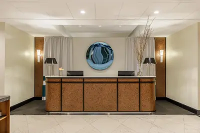a lobby of a hotel with a reception desk at Room Mate Collection Mia, Rome Colosseum in Rome