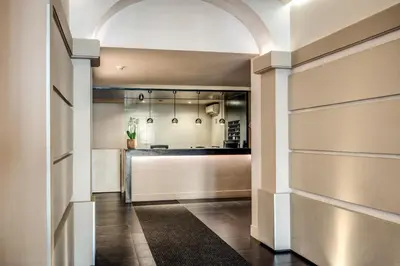 an arched hallway with a kitchen in a building at Hotel Villafranca in Rome