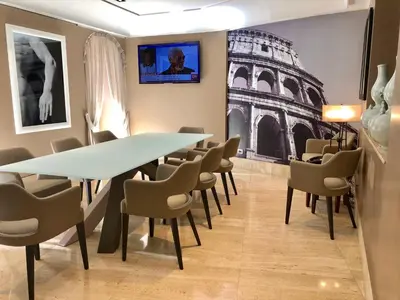 a conference room with a table and chairs at Hotel Indigo Rome - St. George by IHG in Rome