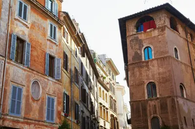 an old building with a clock tower in a city at Hotel Indigo Rome - St. George by IHG in Rome