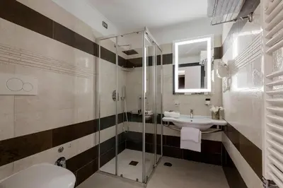 a bathroom with a shower and a sink and a toilet at Yes Hotel Boutique Rome in Rome