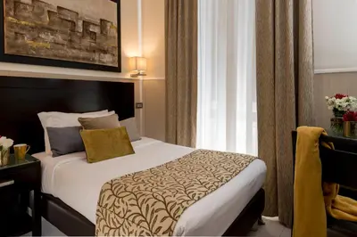 a hotel room with a bed and a window at Yes Hotel Boutique Rome in Rome