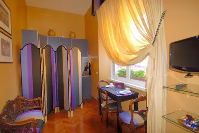 a room with a table and a dining room at Suite Casa Pariolina in Rome