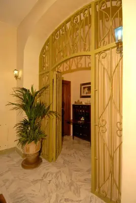 an open door with a potted plant in a room at Suite Casa Pariolina in Rome