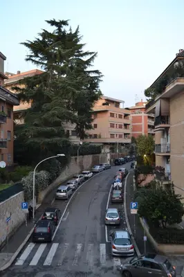 a street with cars parked on the side of the road at Posada de Liz y Fabrizio in Rome