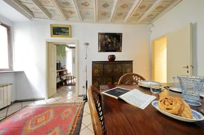 a wooden table with a plate of food on it at Sangallo Charme in Rome