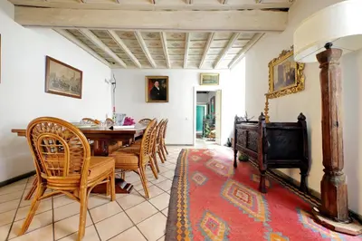 a dining room with a table and chairs at Sangallo Charme in Rome