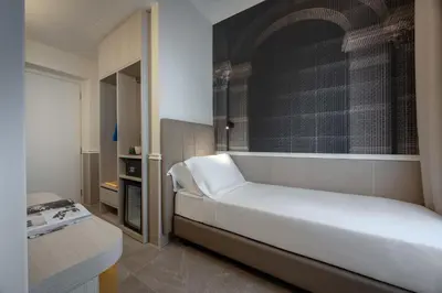a bathroom with a toilet and a shower and a sink at Hotel Astoria Garden in Rome