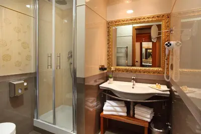 a bathroom with a sink and a shower at Hotel Serena srl in Rome