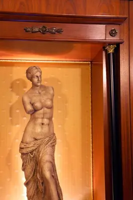 a statue of a man in a display case at Hotel Serena srl in Rome