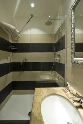 a bathroom with a tub and a sink and a shower at Duca d'Alba Hotel - Chateaux & Hotels Collection in Rome