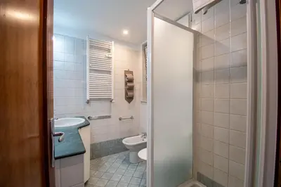 a bathroom with a toilet and a sink at La Casa dei Sogni di Serena in Rome