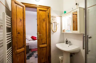 a small bathroom with a sink and a toilet at La Dolce Vita Roma in Rome