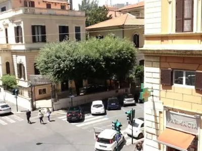 an aerial view of a city street with cars at La Dolce Vita Roma in Rome
