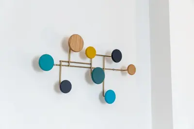 a cluster of drums on a white wall at Guesthouse Sant'Angelo in Rome