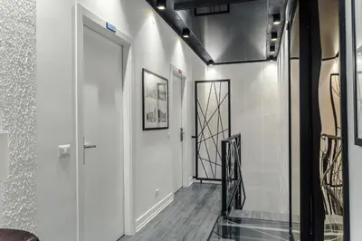 a hallway with white walls and a glass door at Guesthouse Sant'Angelo in Rome