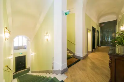 a hallway of a building with an archway at Babuino 79 in Rome