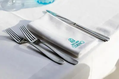 a pair of forks and a napkin on a table at Villa Zaccardi in Rome