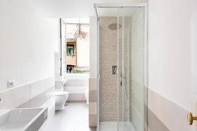 a bathroom with a shower and a toilet at SuityRHome RioneMonti56 in Rome