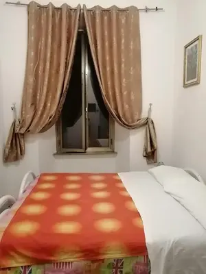 a bedroom with a bed and a window at Roma Prince Inn accommodation in Rome
