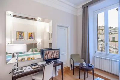 a room with a desk with a computer and a window at Internazionale Domus in Rome