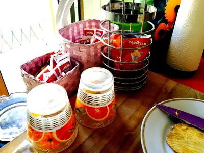 a wooden table with jars of food on top of it at Shelisa B&B in Rome
