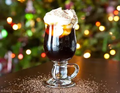 a drink with whipped cream in a glass on a table at Shelisa B&B in Rome