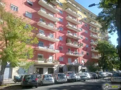 a large building with cars parked in front of it at Shelisa B&B in Rome