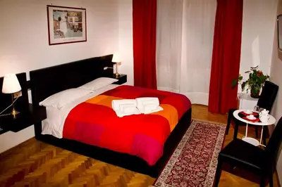 a bedroom with a bed with a colorful blanket at Vatican Dream in Rome