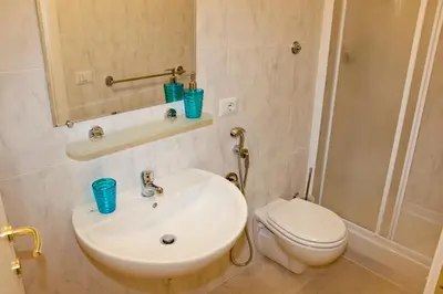 a bathroom with a white sink and a toilet at Vatican Dream in Rome