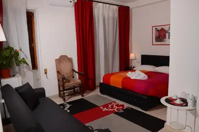 a bedroom with a bed and a couch in it at Vatican Dream in Rome