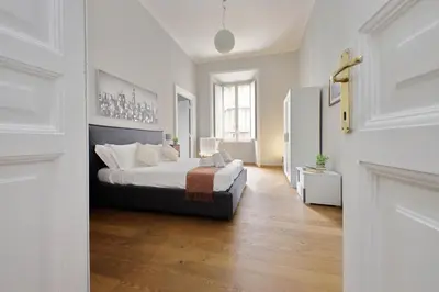 a bedroom with a large bed in a room at 4BNB - Spacious Belli Apartment in Rome