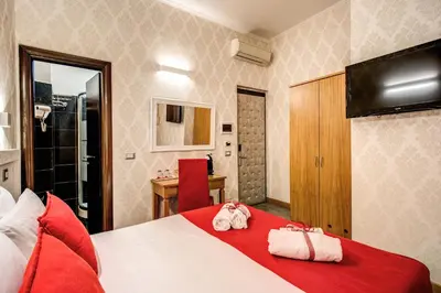 a hotel room with a bed with towels on it at Auditorium Mecenate in Rome