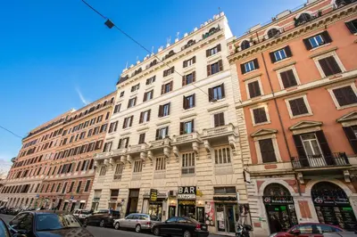 a large building with cars parked in front of it at Auditorium Mecenate in Rome