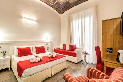a bedroom with two beds with stuffed animals on it at Auditorium Mecenate in Rome