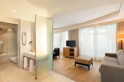a living room with a couch and a television at Precise House Mantegna Roma in Rome