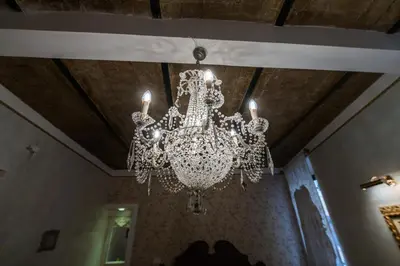 a chandelier hanging from a ceiling in a room at Il Covo B&B in Rome