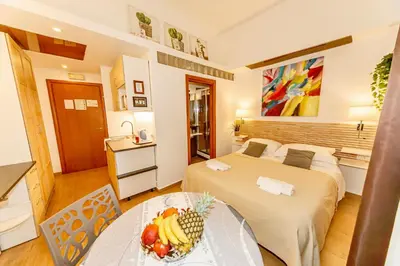 a bedroom with a bed with a painting on the wall at Internouno in Rome