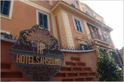 a house with a sign in front of a building at San Anselmo in Rome