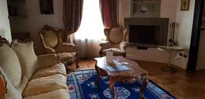 a living room with a couch and a coffee table at San Anselmo in Rome