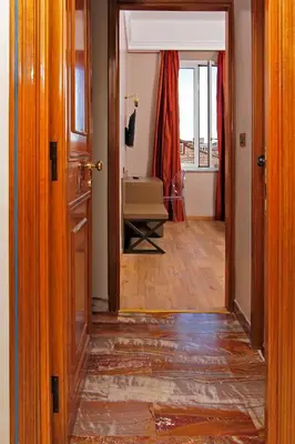 an open door leading into a room with a hallway at Hotel Arcangelo in Rome