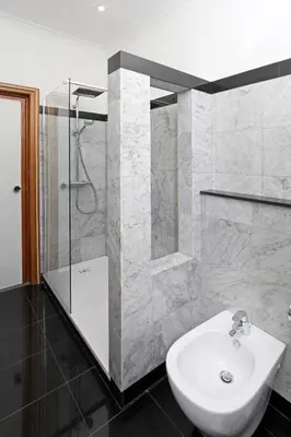 a bathroom with a white sink and a shower at Hotel Arcangelo in Rome
