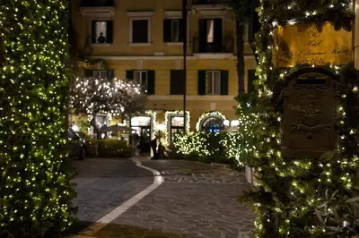 a street decorated with christmas lights and a building at Hotel Villa San Lorenzo Maria in Rome