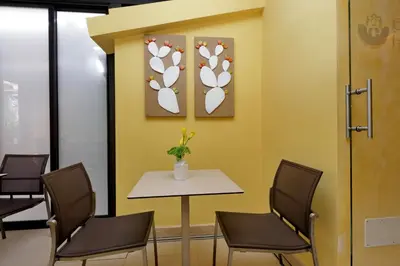 a waiting room with a table and chairs at Hotel Camelia in Rome