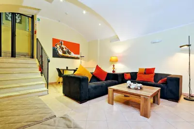 a living room with two couches and a coffee table at Hotel Camelia in Rome