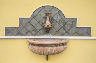 a window with a pot on a wall at Hotel Latinum in Rome