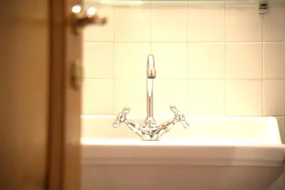a bathroom sink with a faucet on top of it at Hotel Locanda Cairoli in Rome