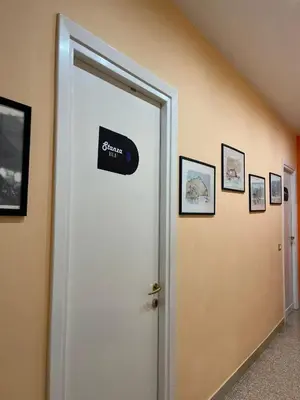 a door with a sign on it in a room at B&B Anni 50 in Rome