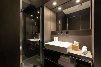 a bathroom with a sink and a mirror at Coronari Palace in Rome