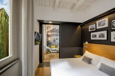 a bedroom with a bed and a window at Coronari Palace in Rome